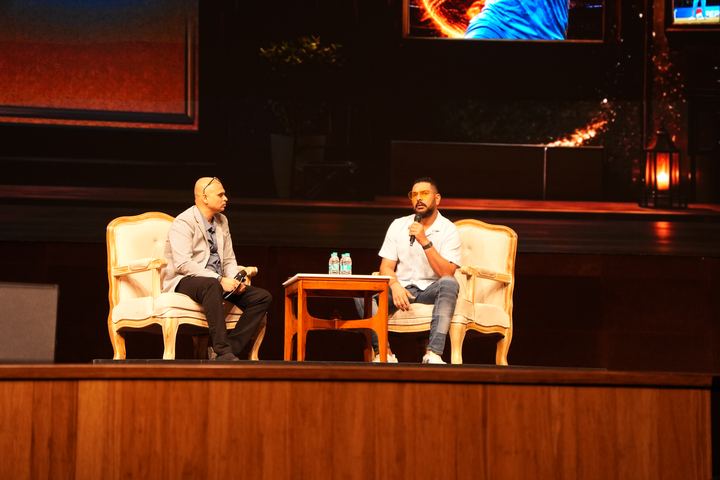 A fireside session on stage at UBCC